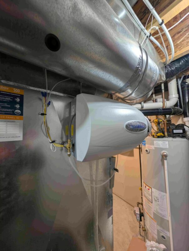 Aprilaire bypass humidifier connected to ductwork.