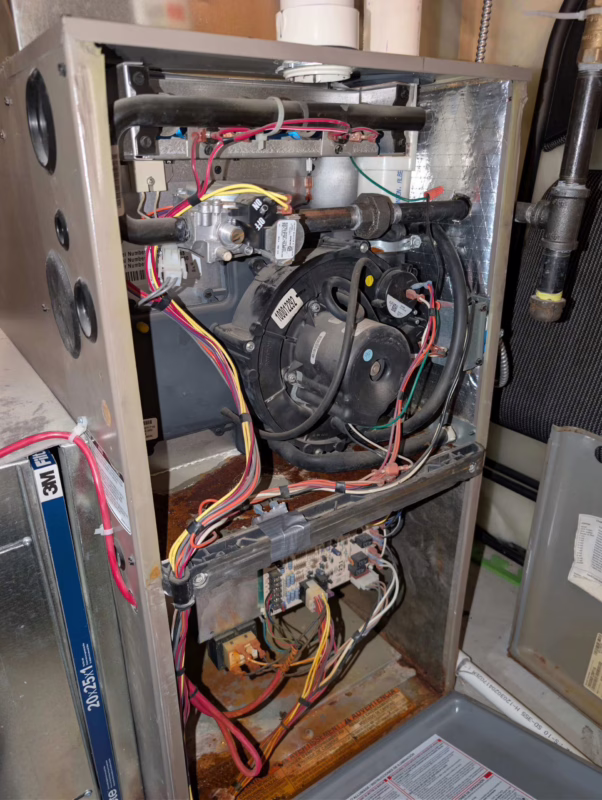 Rusted old furnace internal parts.